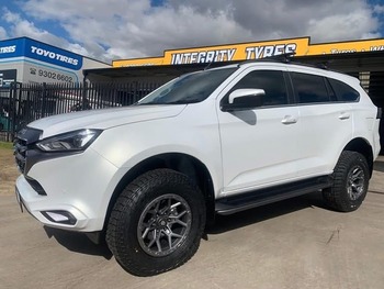  White Isuzu MU-X with aftermarket off-road wheels