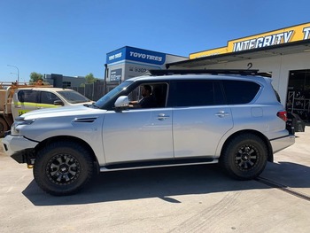  Silver Toyota LandCruiser 300 side profile with black off-road rims
